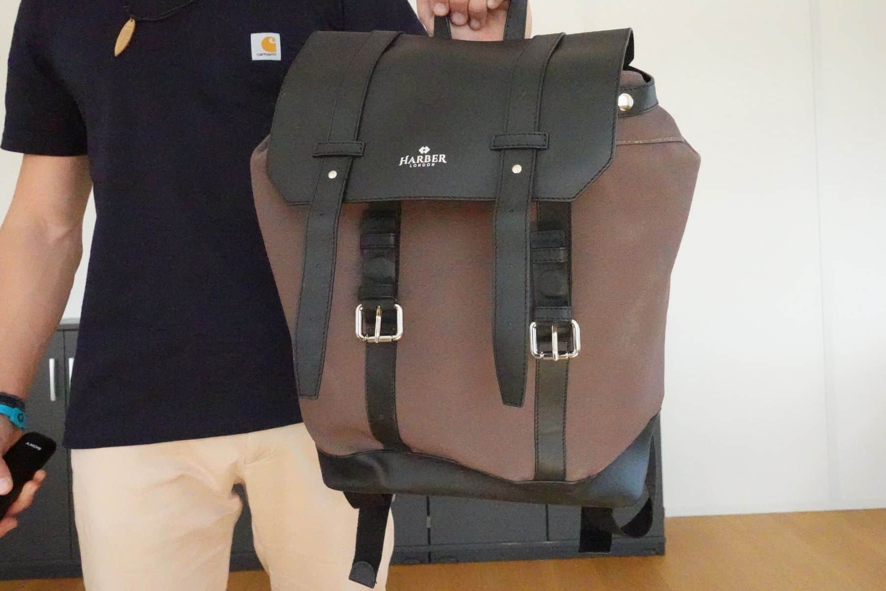 harber-london-classic-rucksack-held-on-one-hand-front-view