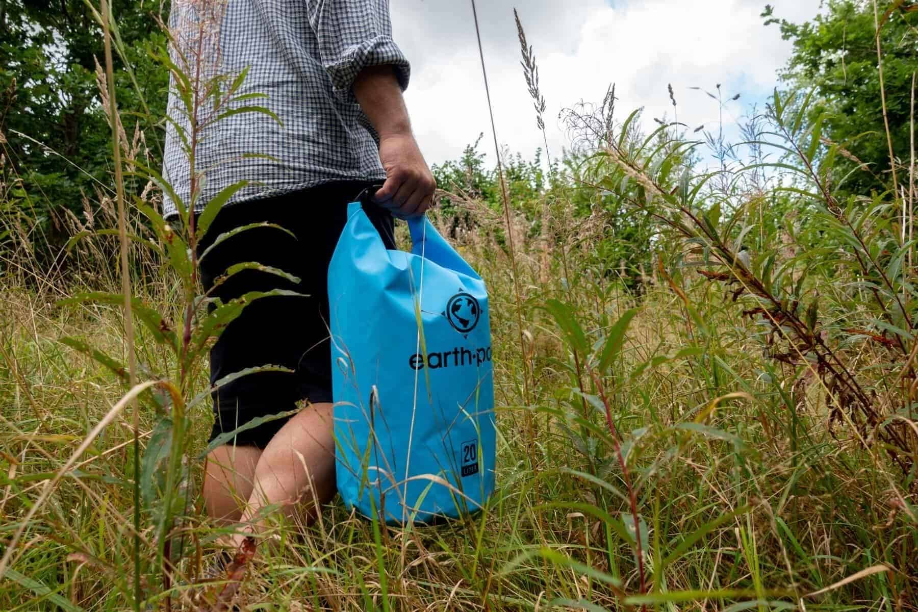 earth-pak-waterproof-held-by-hand