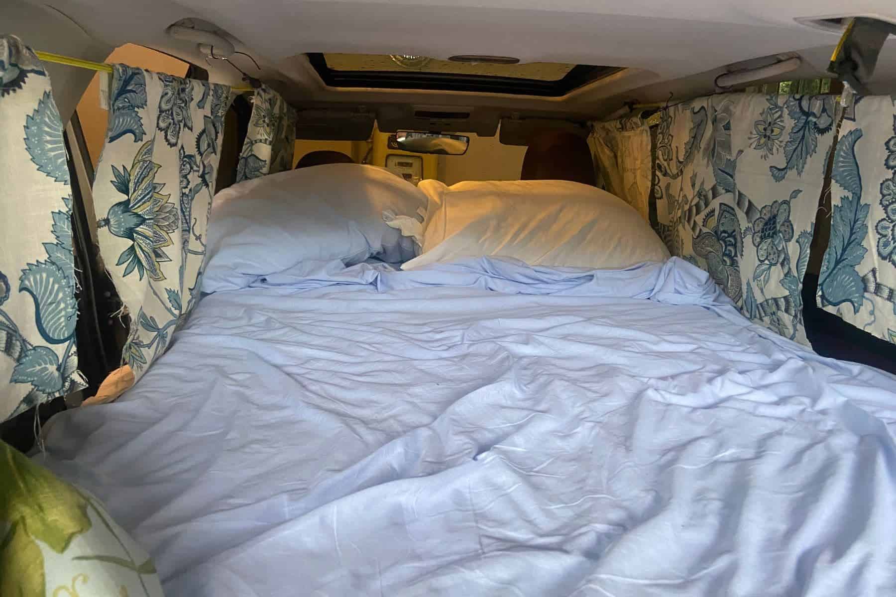 The buildout in the back of my car before I invested in a rooftop tent
