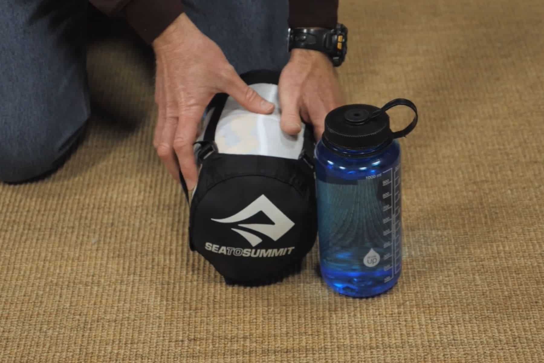 It's just a bit bigger than a Nalgene bottle, and you can compress it to size it down even more. 