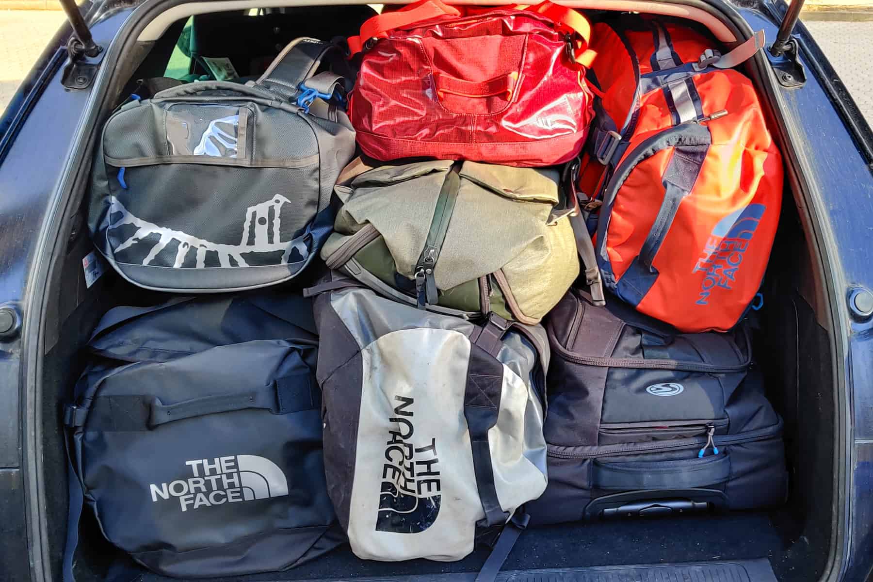 Variations Of Duffel Bags Stuffed In A Car