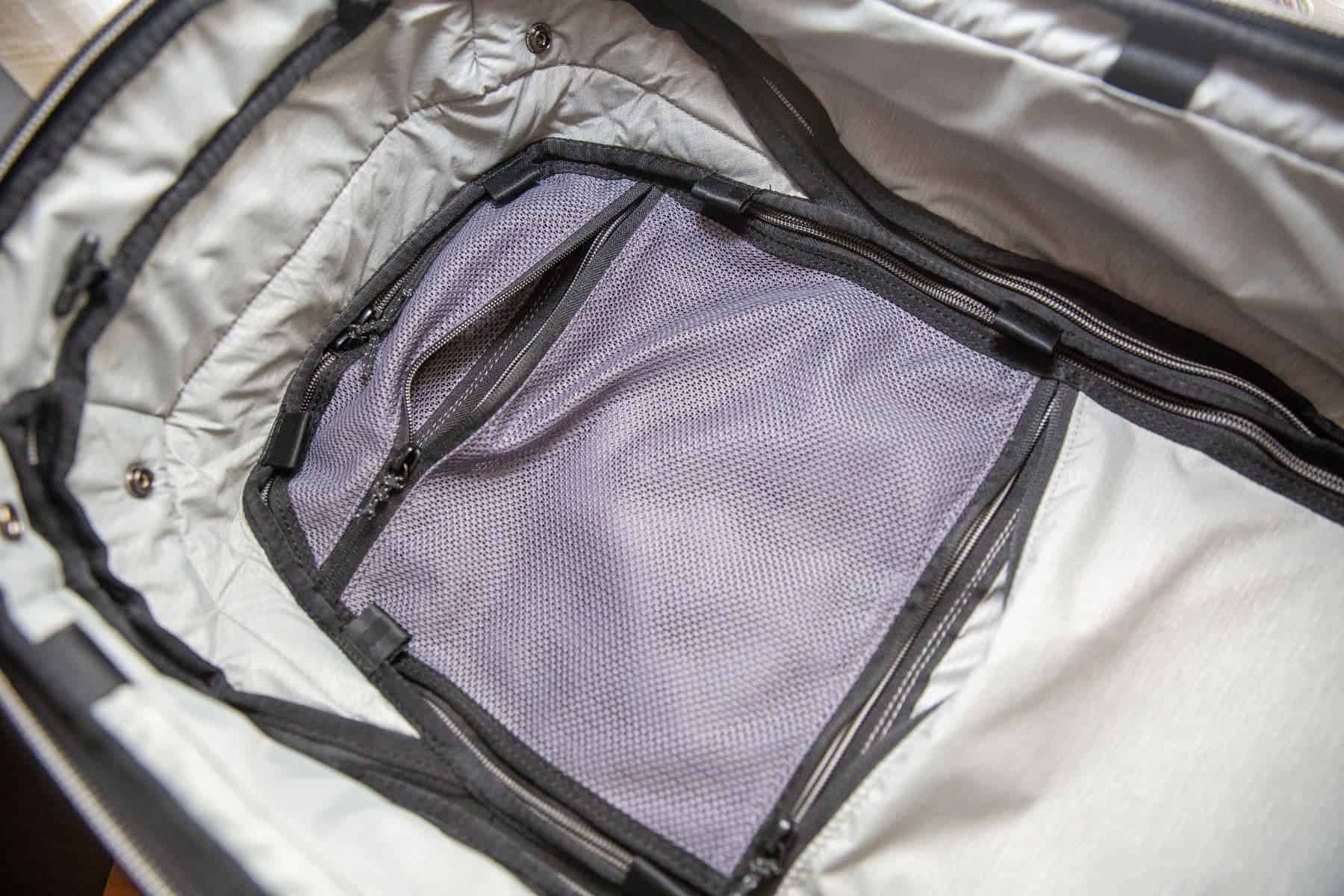 The inner front compartment pockets have pass through openings to be able to access from both bag openings
