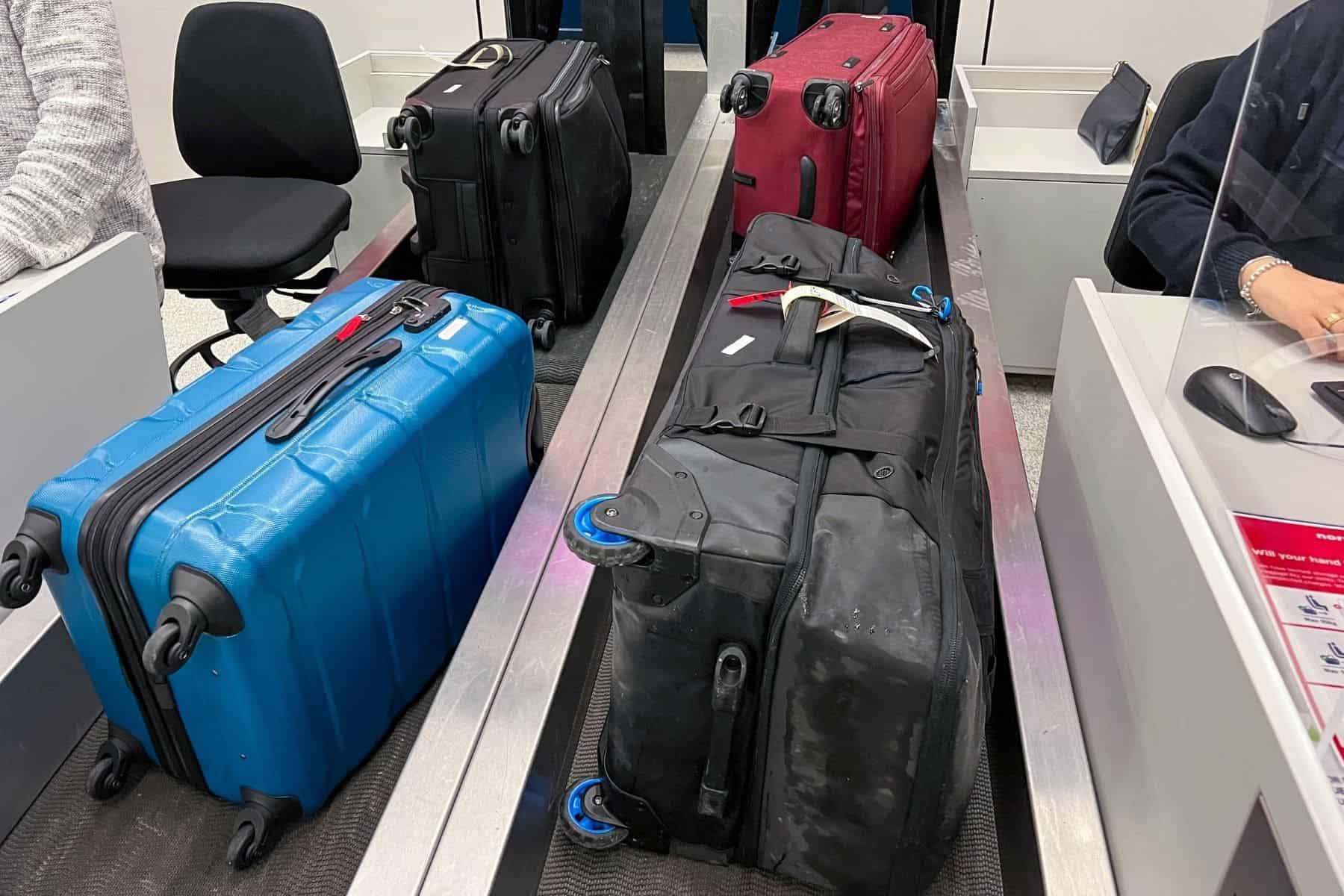 suitcases-and-travel-luggages-checked-at-ticket-counter