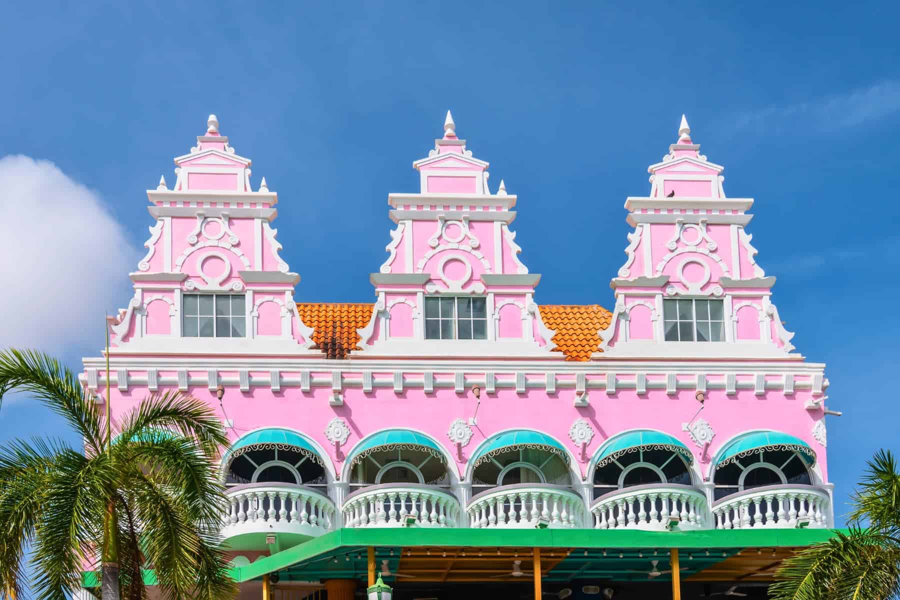 Beautiful pink colored facade of Dutch colonial architecture in city center of Oranjestad, Aruba.